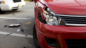 front of a red car that has been in an accident