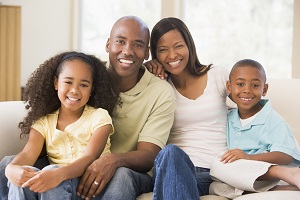 family smiling at camera